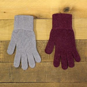 Two Gloves On A Wooden Background